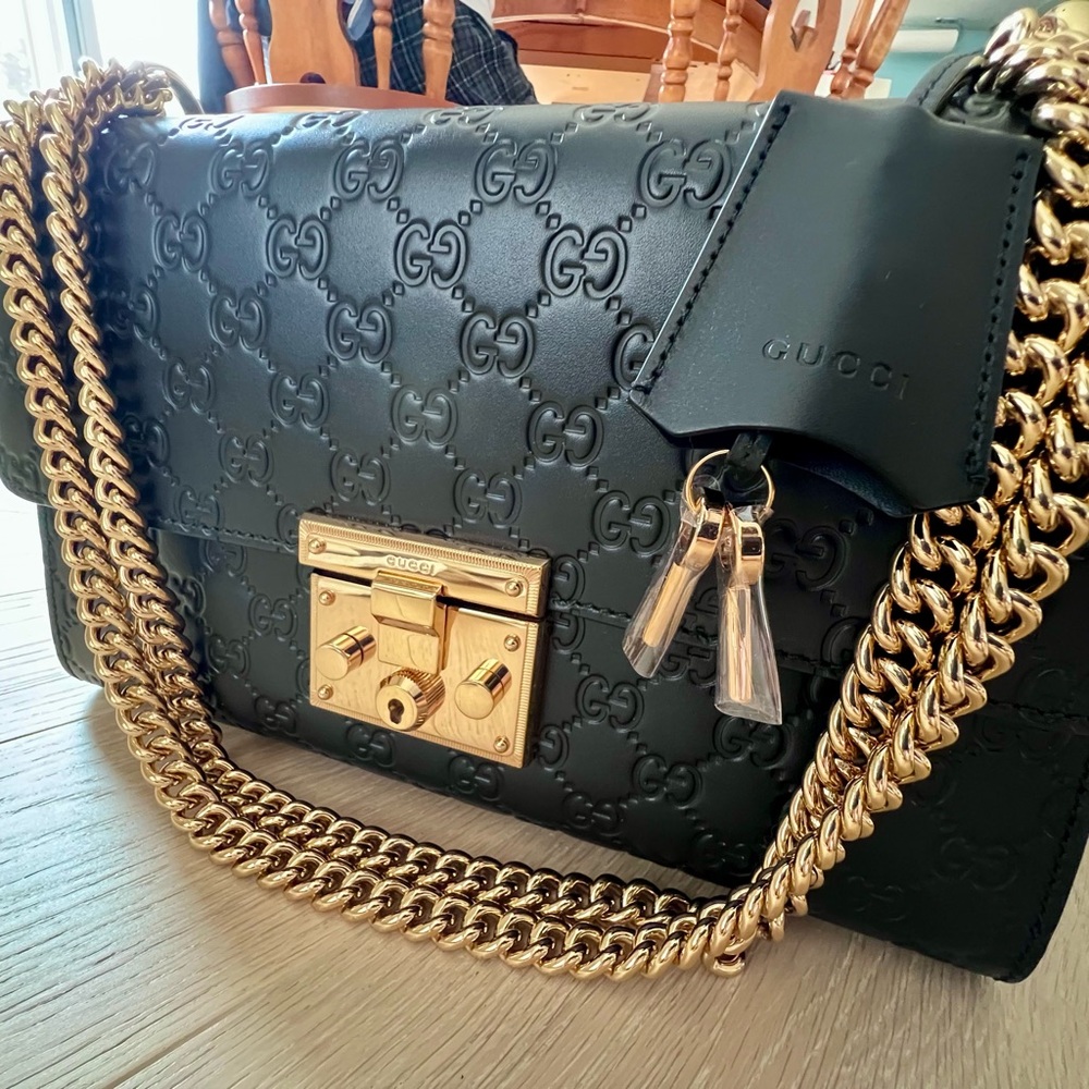Gucci Black and Gold Shoulder Bag with Iconic GG Monogram